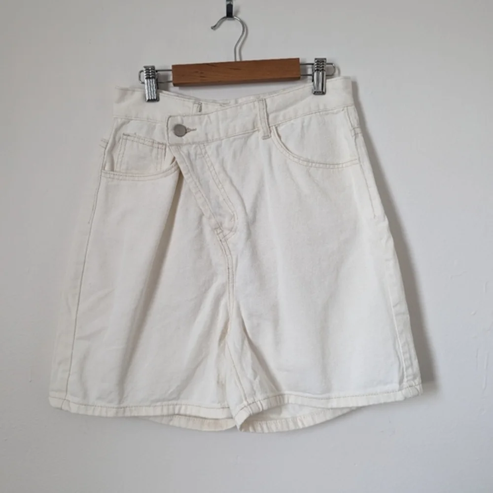 NWT‎ 12th Tribe bone off white ivory asymmetric crisscross Dylan denim shorts